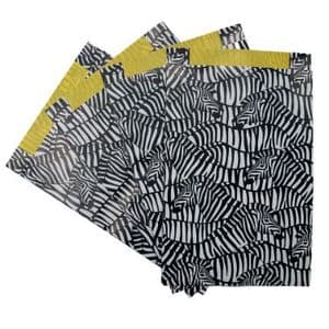 Picture 1 of Cadeauzakjes gecoat papier 25cm x4cm x 34cm wit/zwart/geel zebra's 80gr / m2